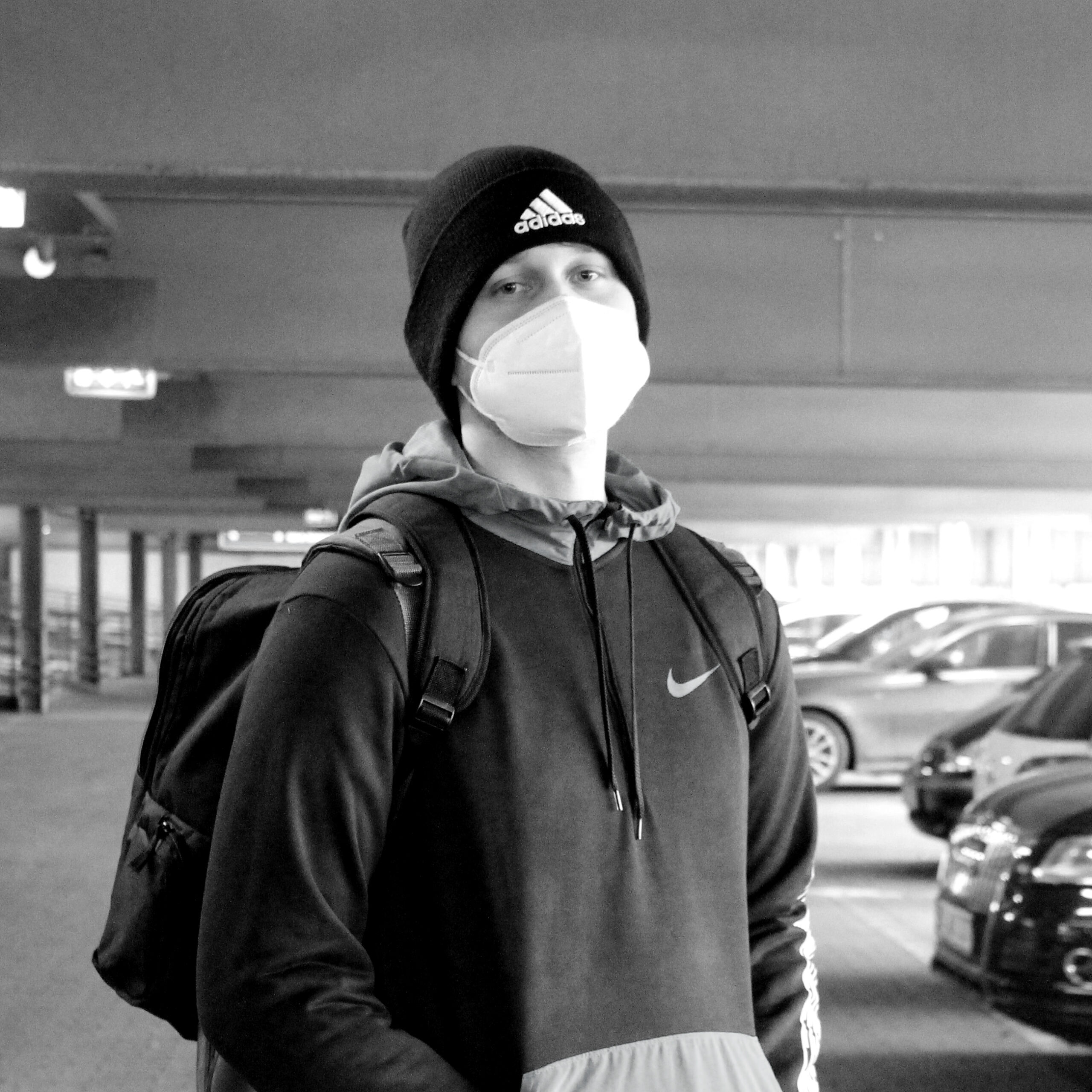 Kevin Meißner in a parking garage with a covid mask